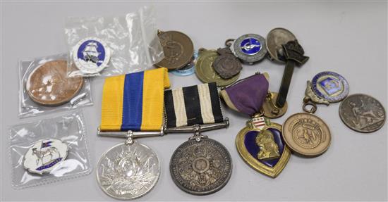 A group of assorted medals and badges including Khedives Sudan medal